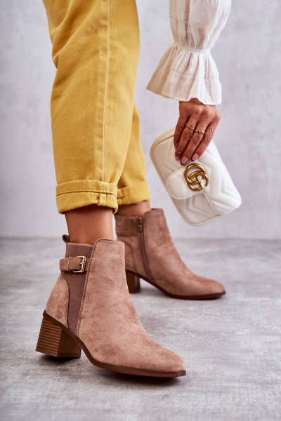 Suede boots on a post Brown Vannes