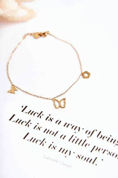 Beinarmband mit Schmetterlingen und einer goldenen Blume