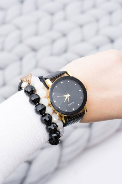 Elegant Women's Black and Gold Watch on Strap